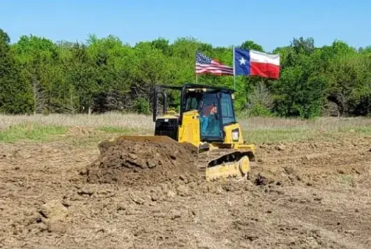 Pushing dirt in a cleared field