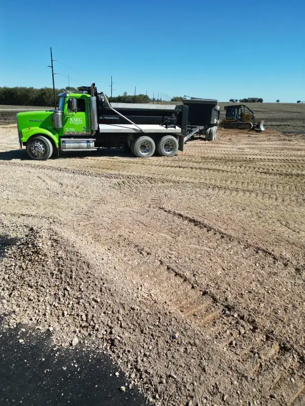 Dump truck hauling in material