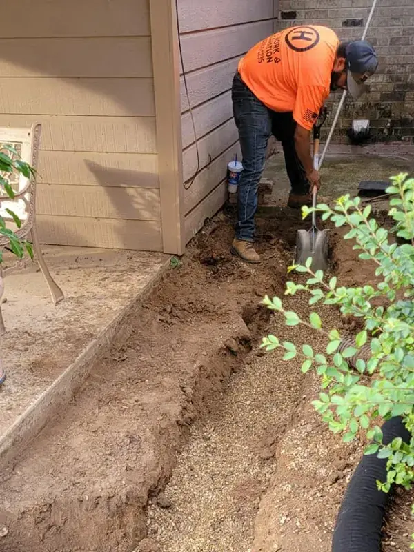 Hand digging a drain line