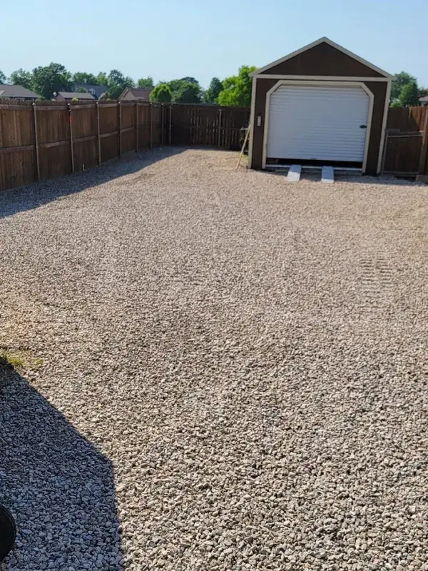 Gravel driveway to a garage