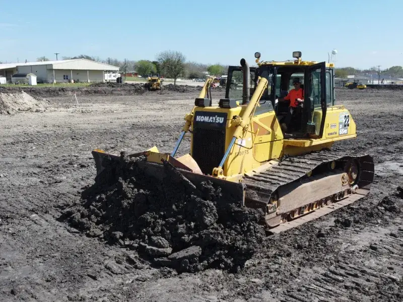 Dozer working a wet field