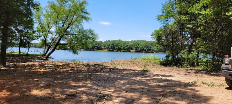 Lot cleared by a pond