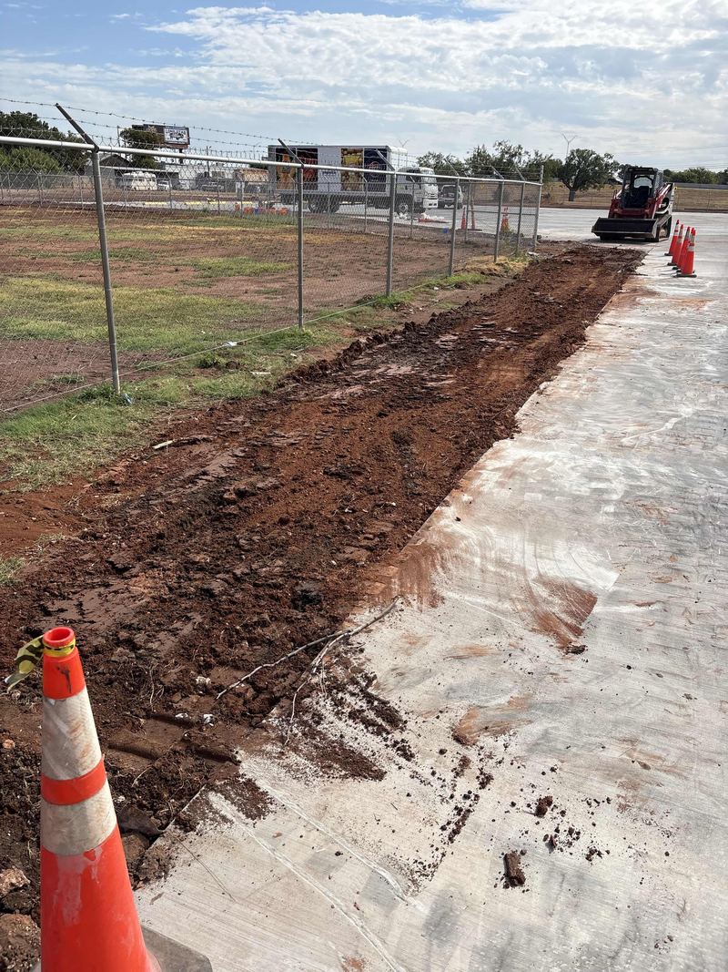 Trenching along a fence